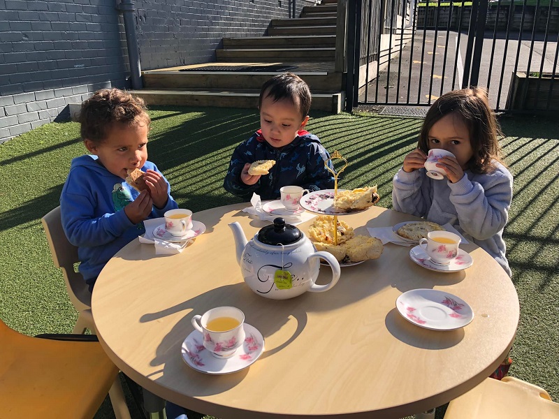 happy kids having a tea party